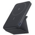 Batería externa inalámbrica negra con soporte para smartphone e indicadores LED